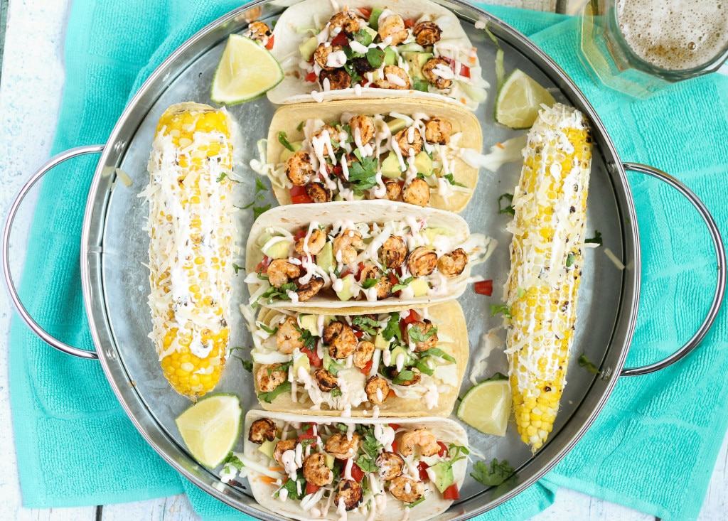 These Grilled Shrimp Tacos are deliciously easy, fun and packed with bright citrus flavor. Topped with a chipotle lime sauce and these babies are taken to a whole other level. Throw the shrimp on the grill for a delicious charred flavor and you've got yourself a quick summer meal perfect for any time of the day. | Strawberry Blondie Kitchen