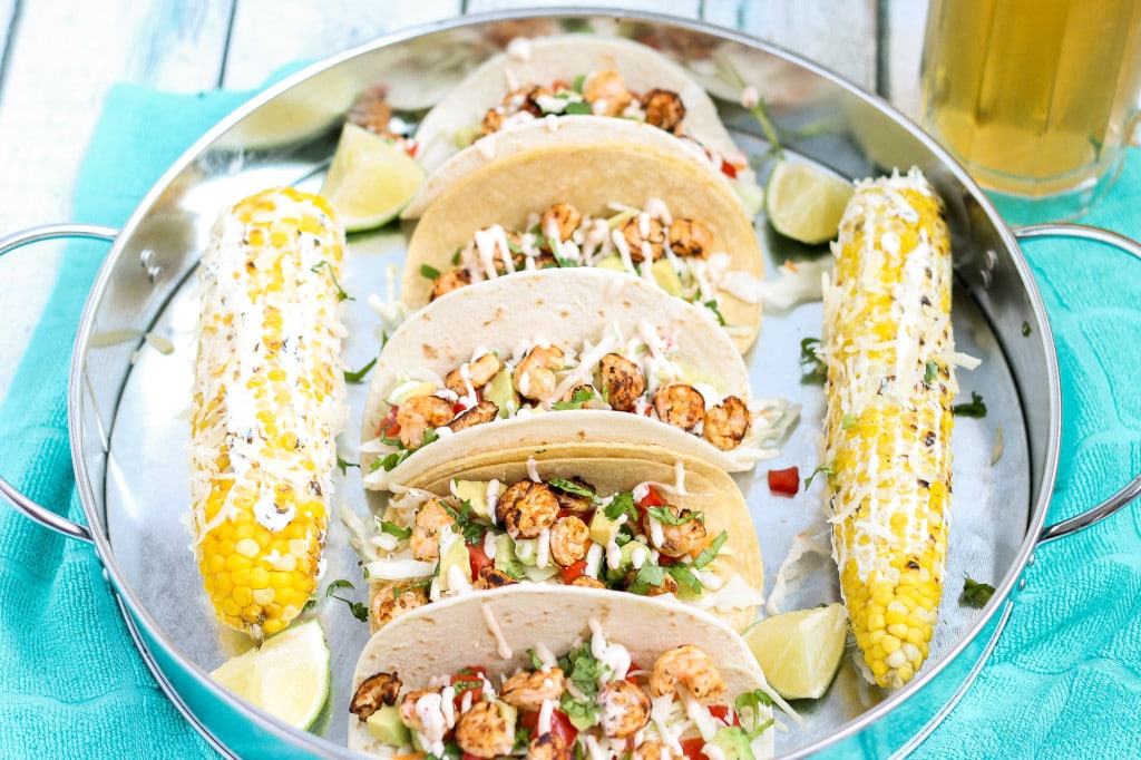 These Grilled Shrimp Tacos are deliciously easy, fun and packed with bright citrus flavor. Topped with a chipotle lime sauce and these babies are taken to a whole other level. Throw the shrimp on the grill for a delicious charred flavor and you've got yourself a quick summer meal perfect for any time of the day. | Strawberry Blondie Kitchen