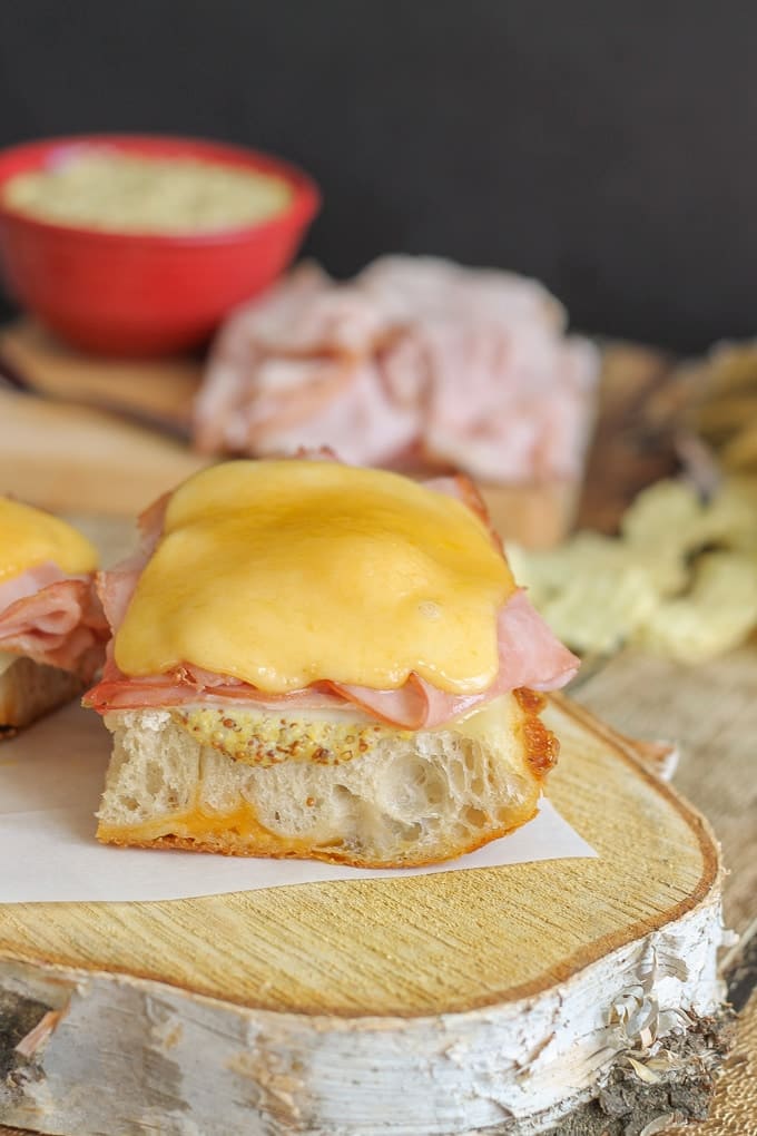 Smoky, melty and cheesy are what these Open Faced Hot Ham and Cheese Sandwiches are made of. Boar's Head SmokeMaster™ Black Forest Ham is the perfect base for these sandwiches that are perfect for a quick dinner, tailgate party or cozy fall meal to gather round the table with family | Strawberry Blondie Kitchen