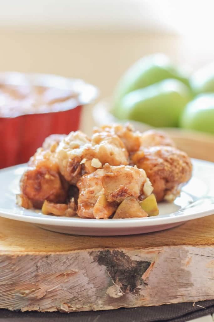 Ooey, Gooey Caramel Apple Monkey Bread is layered with sauteed apples, homemade caramel sauce, cinnamon and pecans. It's a yummy twist on classic monkey bread that'll have you never turning back. | Strawberry Blondie Kitchen