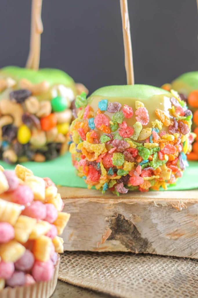 These Caramel Apples are a cinch to make and even better can be personalized to suit everyone in your family! Whether fruity, sweet and salty, peanut butter or toffee is your pleasure, these caramel apples will please any taste bud! They're easier than you think and will have you wondering why you've purchased the store bought kind all these years! | Strawberry Blondie Kitchen