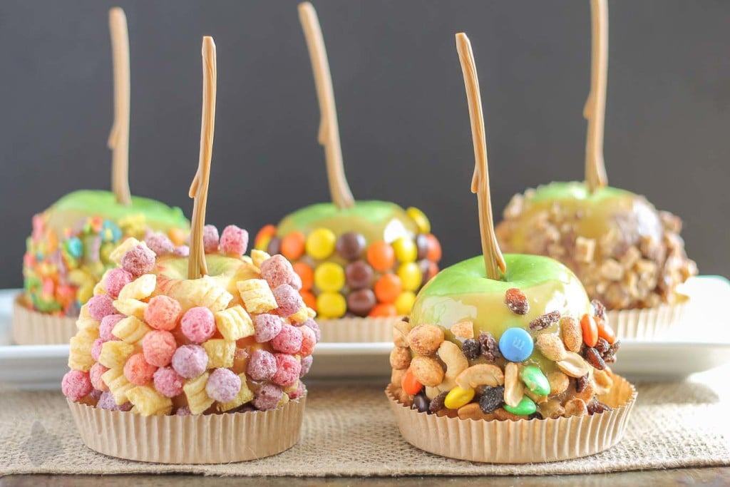 These Caramel Apples are a cinch to make and even better can be personalized to suit everyone in your family! Whether fruity, sweet and salty, peanut butter or toffee is your pleasure, these caramel apples will please any taste bud! They're easier than you think and will have you wondering why you've purchased the store bought kind all these years! | Strawberry Blondie Kitchen