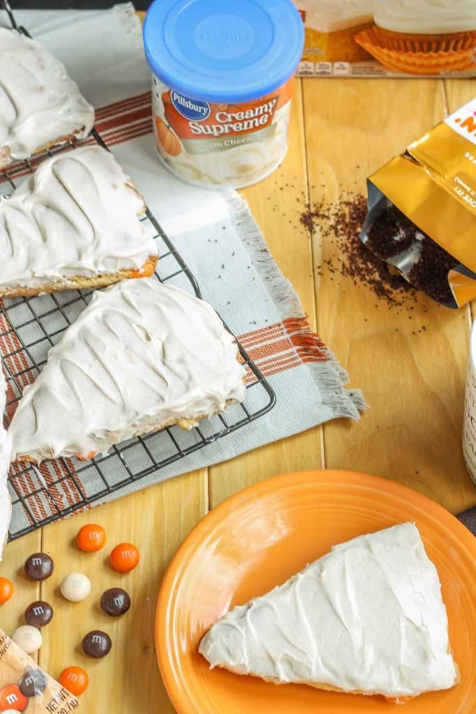 Wake up and enjoy the delicious flavors of fall with these scrumptious Pumpkin Spice Latte Scones. Made with pumpkin spice cake minx, pumpkin spice M&M's and topped with cinnamon cream cheese frosting, these are sure to start your morning off sweetly.