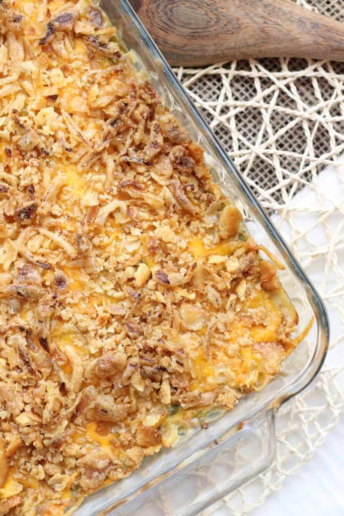 Skip the can of soup this year and make The Best Green Bean Casserole, from scratch.  This version is packed with flavor from the made from scratch fresh mushroom soup, french style green beans, cheddar cheese and french fried onions.  You'll never go back to the can of soup again! | Strawberry Blondie Kitchen