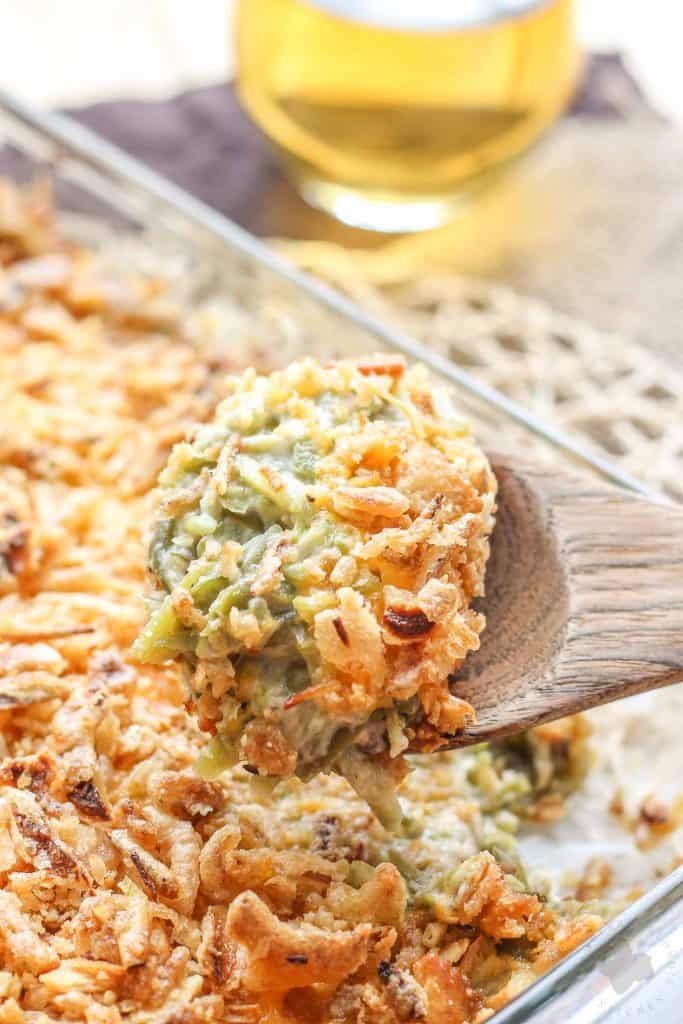 Skip the can of soup this year and make The Best Green Bean Casserole, from scratch.  This version is packed with flavor from the made from scratch fresh mushroom soup, french style green beans, cheddar cheese and french fried onions.  You'll never go back to the can of soup again! | Strawberry Blondie Kitchen