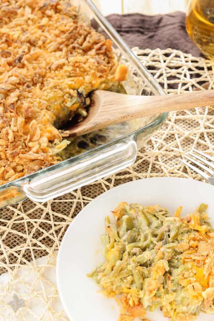 Skip the can of soup this year and make The Best Green Bean Casserole, from scratch.  This version is packed with flavor from the made from scratch fresh mushroom soup, french style green beans, cheddar cheese and french fried onions.  You'll never go back to the can of soup again! | Strawberry Blondie Kitchen