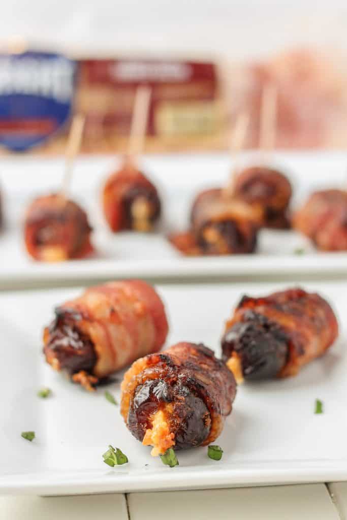 Sweet, creamy, sharp and smoky, these Bacon Wrapped Blue Cheese Stuffed Dates are perfect for your next party!  3 ingredients and super simple, these are sure to be your next go to appetizer for all those upcoming holiday festivities. | Strawberry Blondie Kitchen