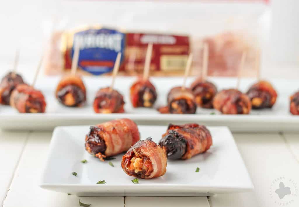 Sweet, creamy, sharp and smoky, these Bacon Wrapped Blue Cheese Stuffed Dates are perfect for your next party!  3 ingredients and super simple, these are sure to be your next go to appetizer for all those upcoming holiday festivities. | Strawberry Blondie Kitchen