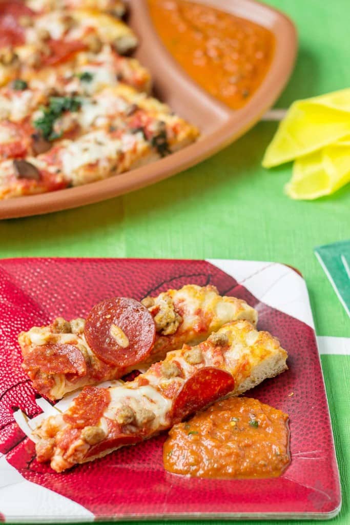 Make the right call during the BIG game this year and tailgate at home. It's simple, easy and stress free which will leave you sitting down just in time to enjoy the game. Serve DIGIORNO® pizza, cut into strips with homemade dipping sauce on the sides. Sure to be a crowd pleaser and having you scoring a TOUCHDOWN! | Strawberry Blondie Kitchen