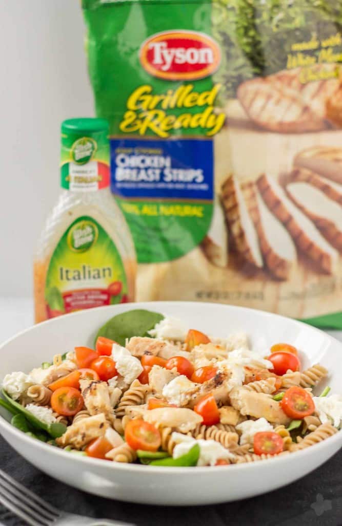 Quick and easy, healthy, portable and delicious, this Layered Chicken Caprese Salad is a meal in a jar. It can be made the night before to save time in the morning or is a perfect prep ahead dinner meal. | Strawberry Blondie Kitchen