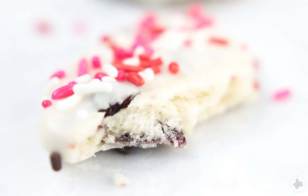 Surprise and delight your Valentine with these White Chocolate Cranberry Shortbread Heart Cookies. Nothing says I love you more than fresh home baked cookies shaped like hearts, dipped in white chocolate and covered in sprinkles!