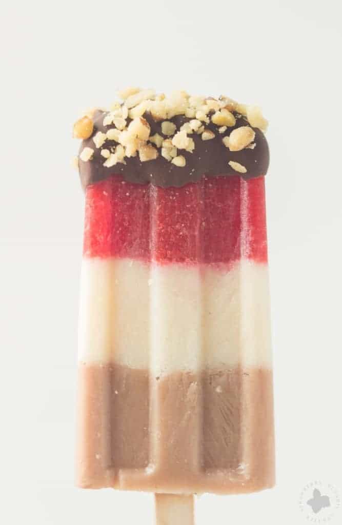 Layers of fresh strawberries, Sir BananamilkTM, and Sir Chocolate BananamilkTM make these Banana Split Popsicles irresistible to both adults and children alike. | Strawberry Blondie Kitchen