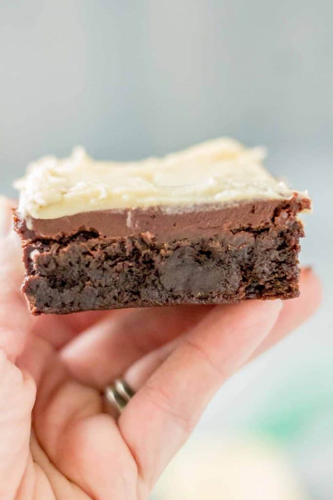 hand holding an Irish Car Bombs Brownie so you can see the inside and the layers