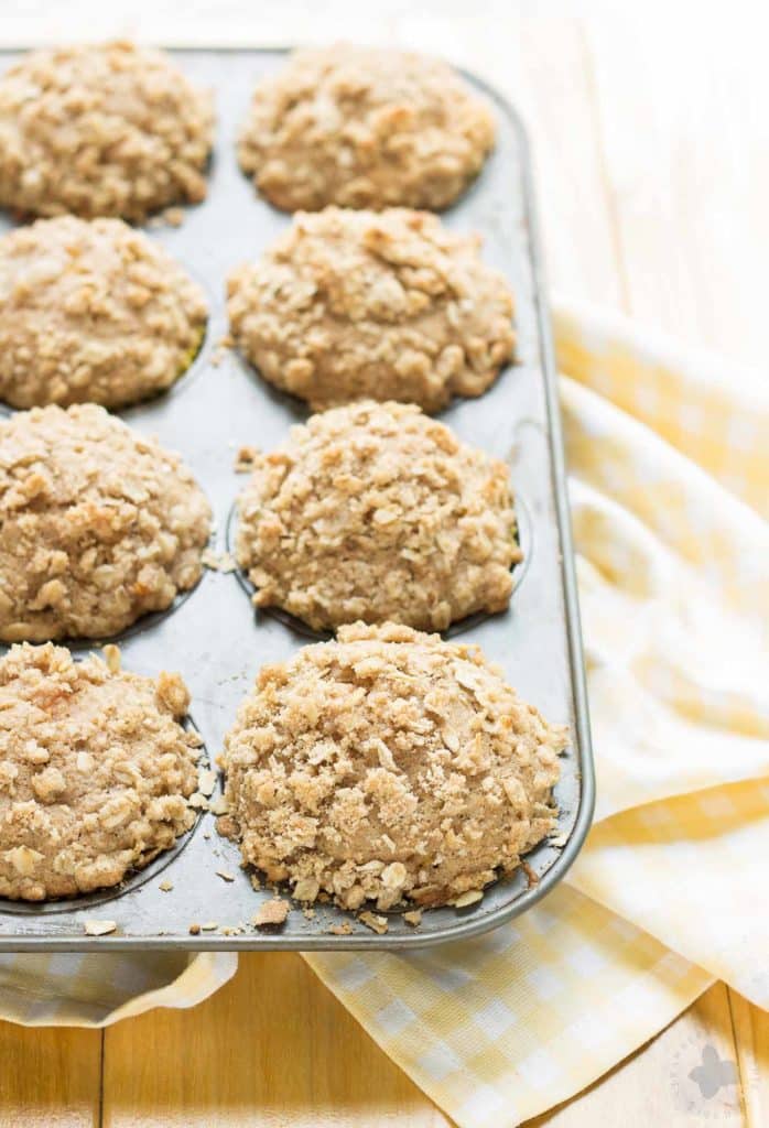 Start your morning with these delicious Peach Oatmeal Crumb Muffins. They're super moist and tender, studded with sweet, juicy peaches and are overflowing with an irresistible oatmeal crumb topping. These just might be your next favorite muffin recipe and for good reason! | Strawberry Blondie Kitchen