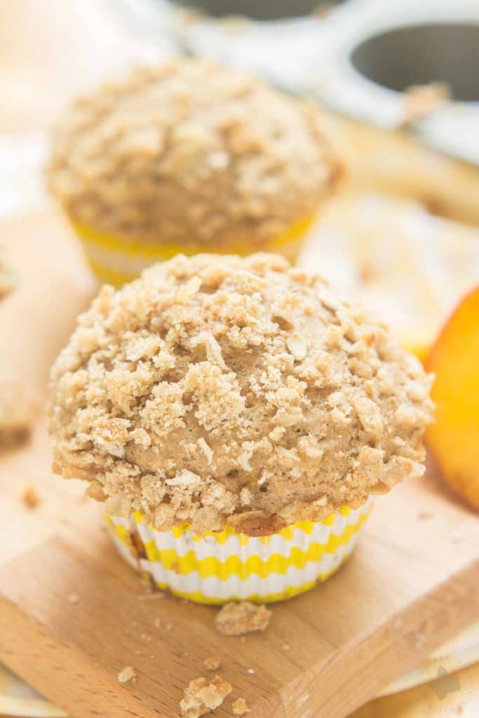 Start your morning with these delicious Peach Oatmeal Crumb Muffins. They're super moist and tender, studded with sweet, juicy peaches and are overflowing with an irresistible oatmeal crumb topping. These just might be your next favorite muffin recipe and for good reason! | Strawberry Blondie Kitchen