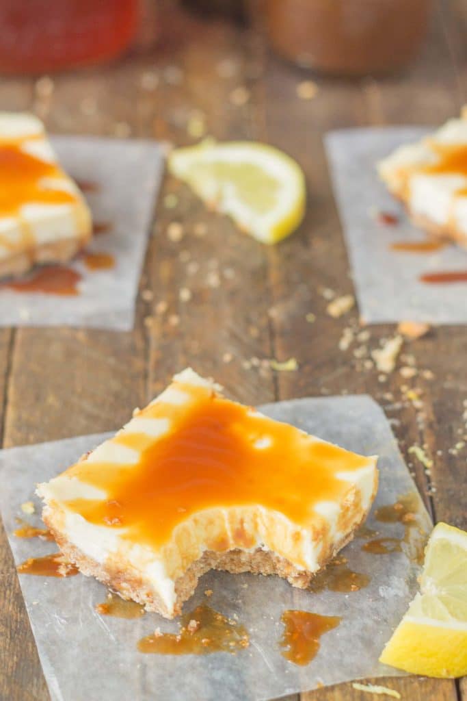 Tangy, tart lemon cheesecake bars are topped with a sweet tea caramel sauce to perfectly marry the two together and create Arnold Palmer Cheesecake Bars. Your favorite way to quench your thirst is now in dessert form! | Strawberry Blondie Kitchen