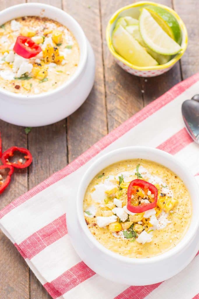 Combine all the flavors you love of Mexican Street Corn and blend them into a delicious summer soup. Sweet corn, lime, chili powder and cheese meld together beautifully to make this luscious and creamy Mexican Street Corn Chowder. | Strawberry Blondie Kitchen