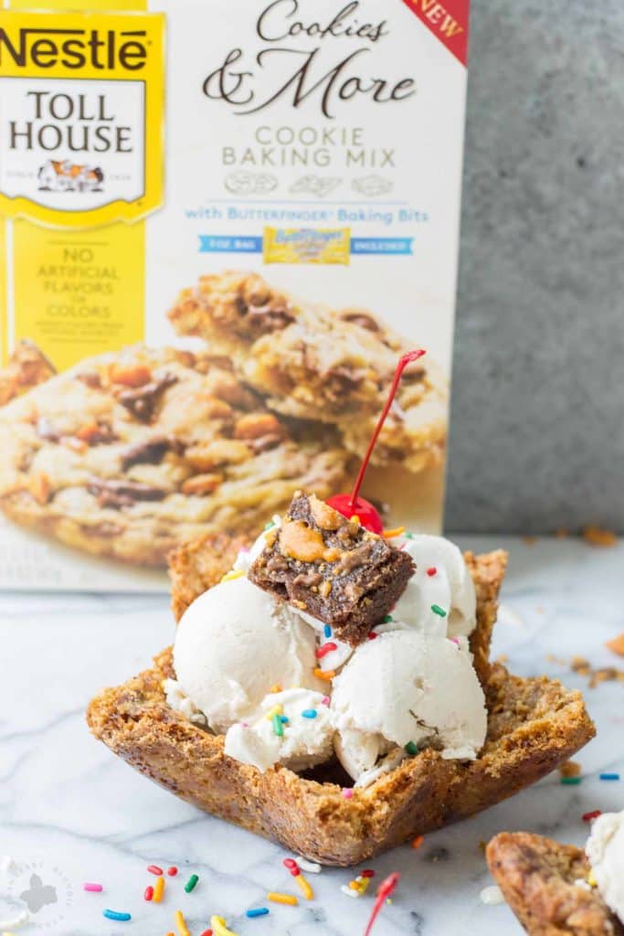 Freshly baked chocolate chip cookies are molded into bowls and piled high with all your favorite ice cream sundae favorites. Now you can have your ice cream and eat the bowl too! The Ultimate Ice Cream Sundae Bowl are an ice cream lovers dream. | Strawberry Blondie Kitchen