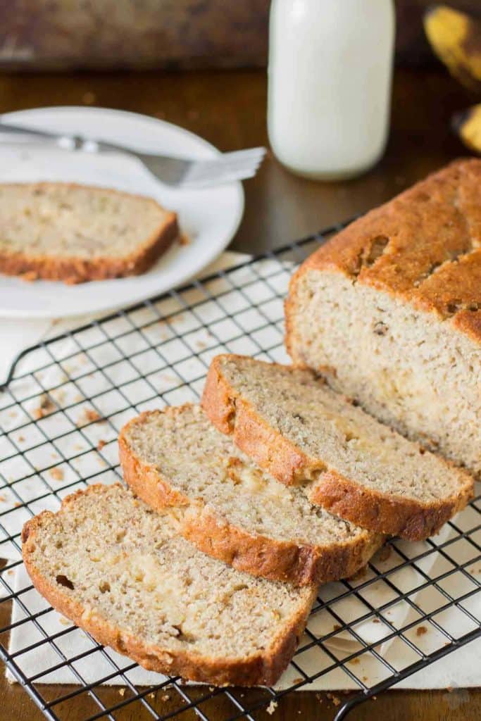 Super moist banana bread is ribboned with brown sugar cream cheese and aromatic spices making this Brown Sugar Stuffed Banana Bread one outstanding quick bread. It's sure to be the last Banana bread recipe you'll ever need! | Strawberry Blondie Kitchen