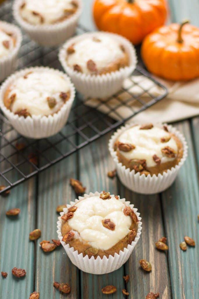 Pumpkin Spice Cream Cheese Muffins are the quintessential treat of Fall. Filled with aromatic autumn spices, stuffed with cream cheese and sprinkled with sugared pepitas, this is sure to be your go to Pumpkin Spice Cream Cheese Muffins recipe. | Strawberry Blondie Kitchen
