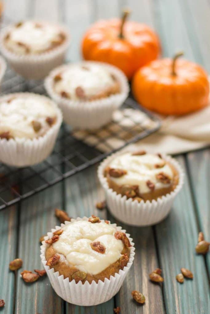 Pumpkin Spice Cream Cheese Muffins are the quintessential treat of Fall. Filled with aromatic autumn spices, stuffed with cream cheese and sprinkled with sugared pepitas, this is sure to be your go to Pumpkin Spice Cream Cheese Muffins recipe. | Strawberry Blondie Kitchen