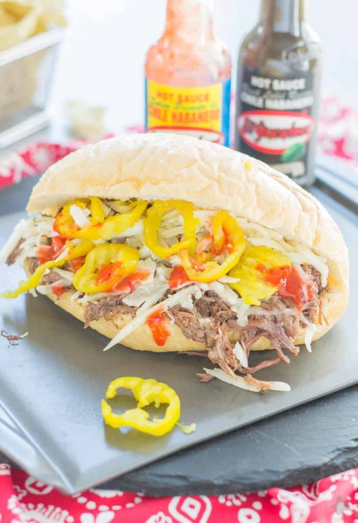 Bolillo rolls are filled with juicy, tender slow cooked beef short ribs, El Yucateco® hot sauce and melty cheese to bring you the ultimate Short Rib Sandwiches. | Strawberry Blondie Kitchen