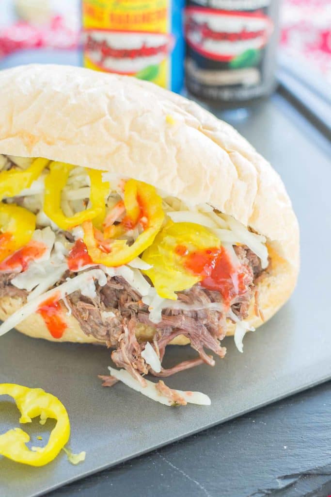 Bolillo rolls are filled with juicy, tender slow cooked beef short ribs, El Yucateco® hot sauce and melty cheese to bring you the ultimate Short Rib Sandwiches. | Strawberry Blondie Kitchen