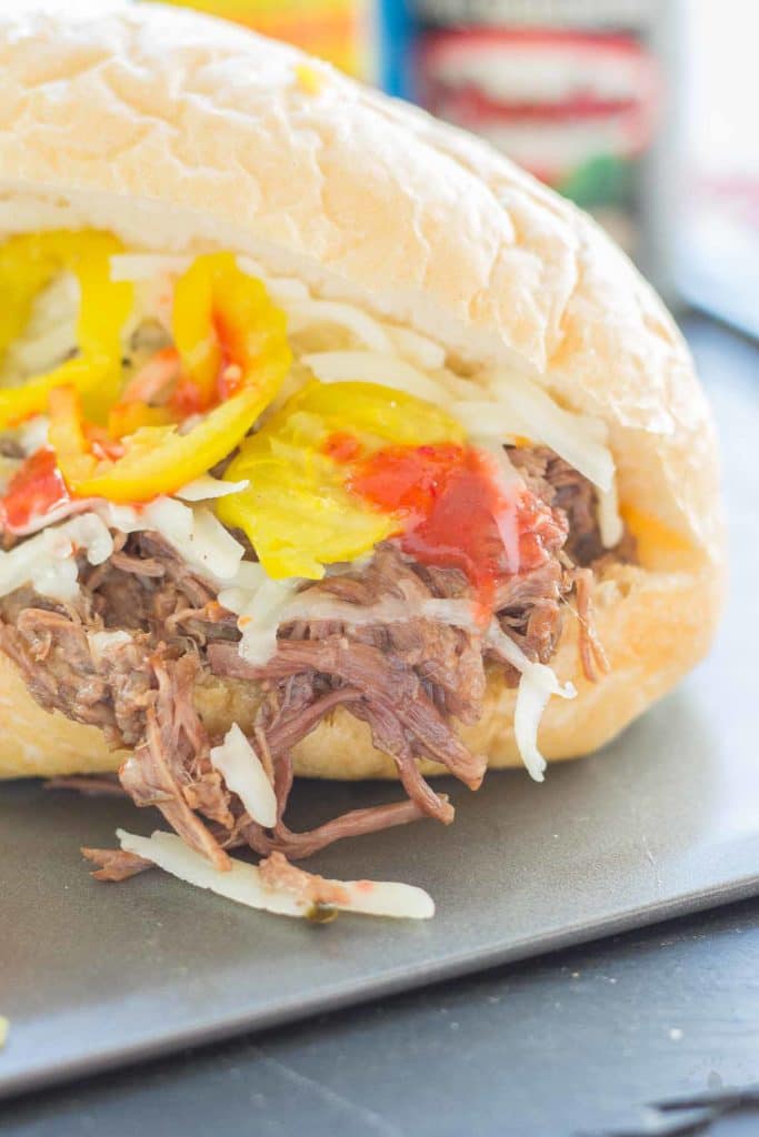 Bolillo rolls are filled with juicy, tender slow cooked beef short ribs, El Yucateco® hot sauce and melty cheese to bring you the ultimate Short Rib Sandwiches. | Strawberry Blondie Kitchen