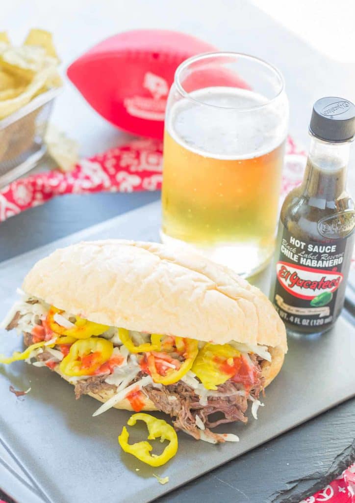 Bolillo rolls are filled with juicy, tender slow cooked beef short ribs, El Yucateco® hot sauce and melty cheese to bring you the ultimate Short Rib Sandwiches. | Strawberry Blondie Kitchen