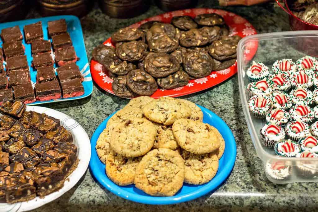 I've got tips to show you How to Throw a fun Holiday Pajama and Cookie Party so you can spend less time in the kitchen baking and more time gathering with friends and sharing treats together. | Strawberry Blondie Kitchen