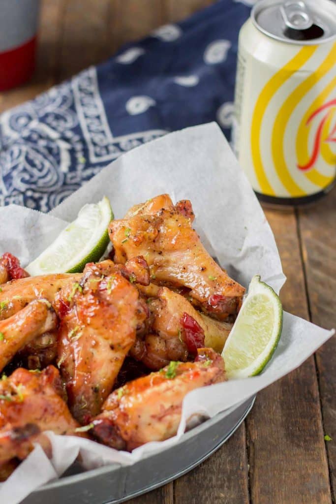 Sweet, tart and tangy, these Cherry Lime Baked Wings are delicious and addictive. Be sure to make a big batch, they're sure to be the hit of your next game day party! | Strawberry Blondie Kitchen