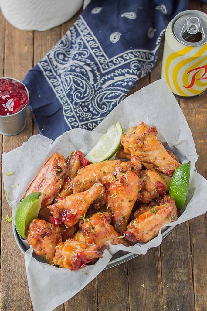 Sweet, tart and tangy, these Cherry Lime Baked Wings are delicious and addictive. Be sure to make a big batch, they're sure to be the hit of your next game day party! | Strawberry Blondie Kitchen