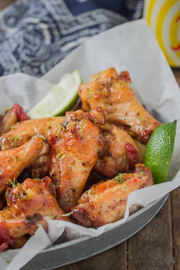 Sweet, tart and tangy, these Cherry Lime Baked Wings are delicious and addictive. Be sure to make a big batch, they're sure to be the hit of your next game day party! | Strawberry Blondie Kitchen
