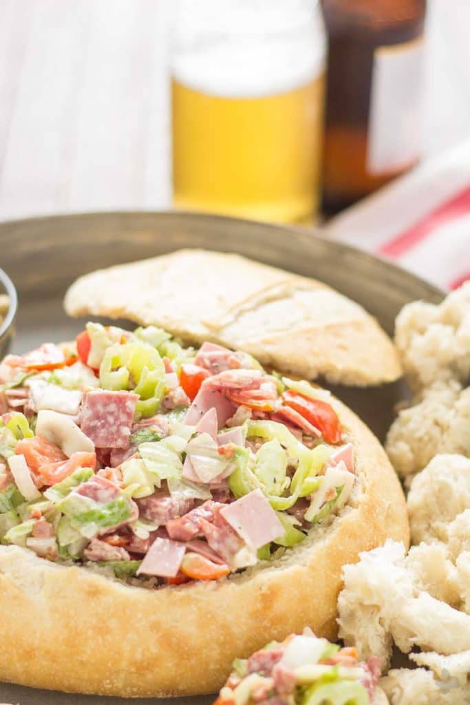 All the classic favorites of an Italian deli sandwich, Meats, cheese, peppers, lettuce and dressing all piled high on top of a baguette make this Chicago Style Hoagie Dip a new game day favorite! | Strawberry Blondie Kitchen