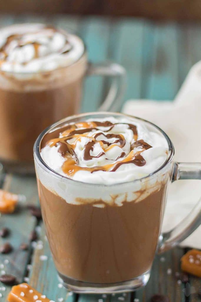 Creamy espresso blends perfectly with chocolate and almond milk, topped with whipped cream, caramel drizzle and a sprinkle of sea salt, making this Sea Salt Caramel Mocha irresistibly delicious! | Strawberry Blondie Kitchen