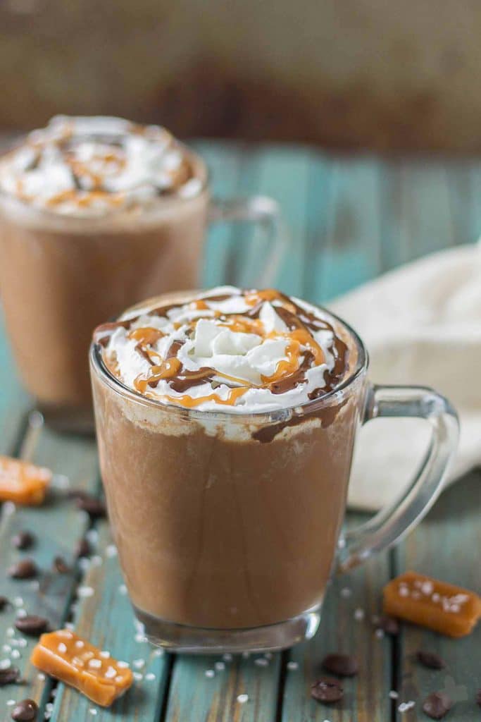 Creamy espresso blends perfectly with chocolate and almond milk, topped with whipped cream, caramel drizzle and a sprinkle of sea salt, making this Sea Salt Caramel Mocha irresistibly delicious! | Strawberry Blondie Kitchen