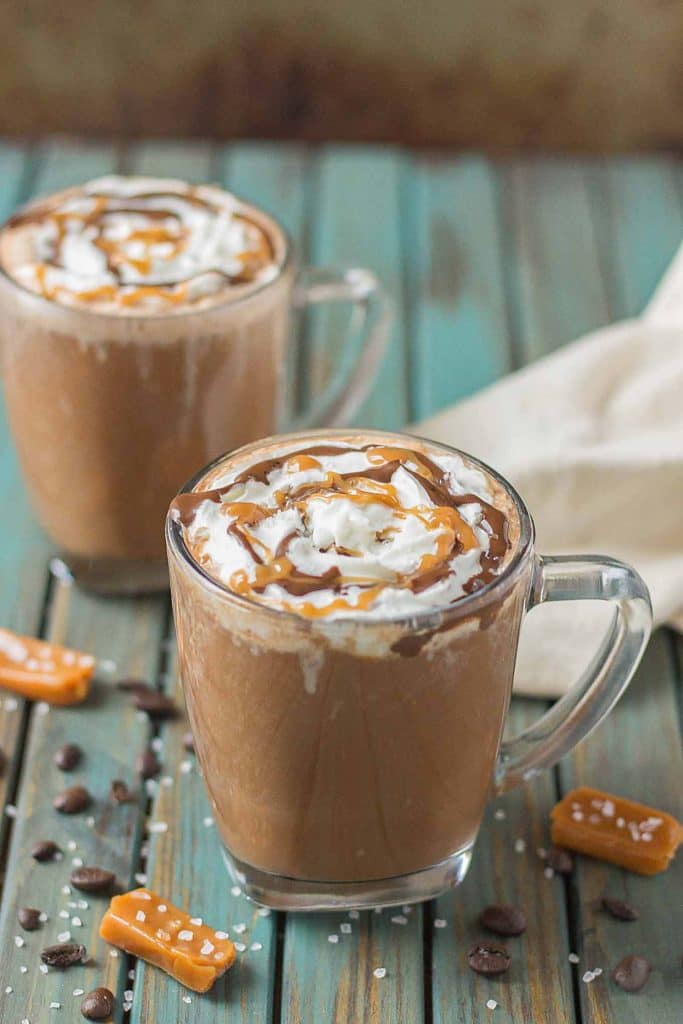 Creamy espresso blends perfectly with chocolate and almond milk, topped with whipped cream, caramel drizzle and a sprinkle of sea salt, making this Sea Salt Caramel Mocha irresistibly delicious! | Strawberry Blondie Kitchen