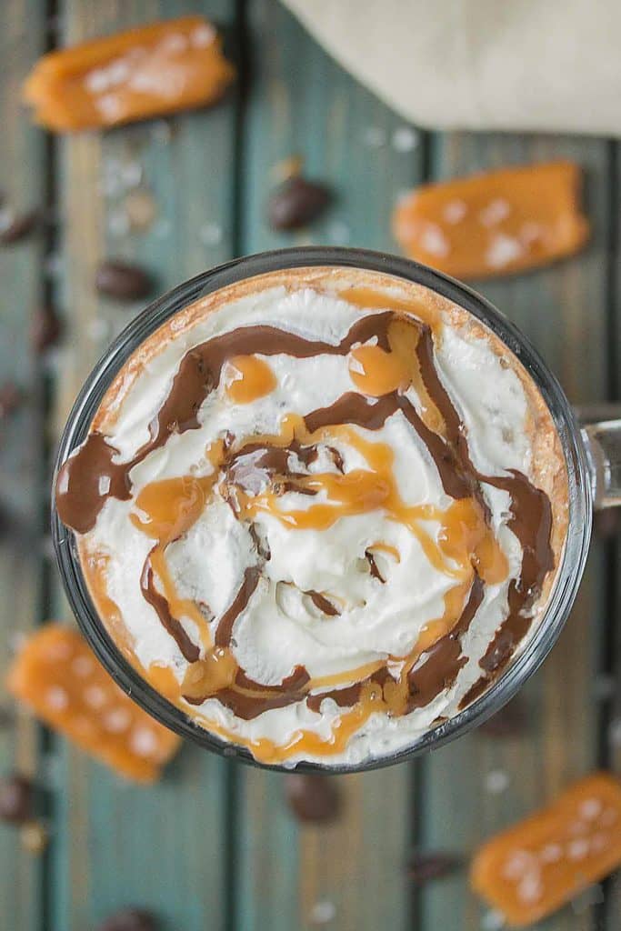 Creamy espresso blends perfectly with chocolate and almond milk, topped with whipped cream, caramel drizzle and a sprinkle of sea salt, making this Sea Salt Caramel Mocha irresistibly delicious! | Strawberry Blondie Kitchen