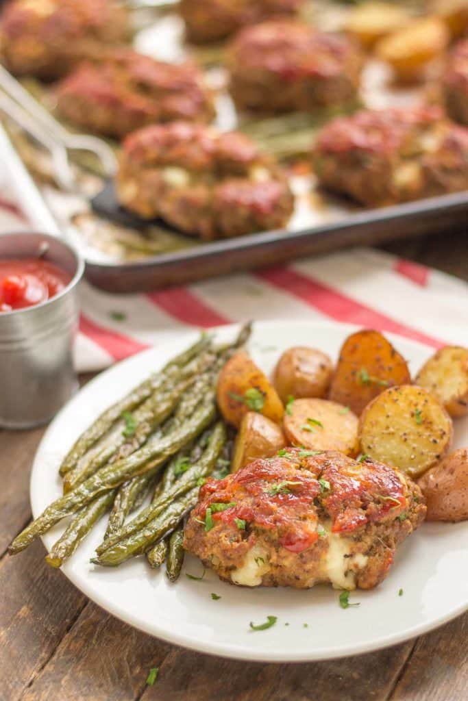 Sheet Pan Mini Meatloaves with Potatoes and Green Beans on a white plate