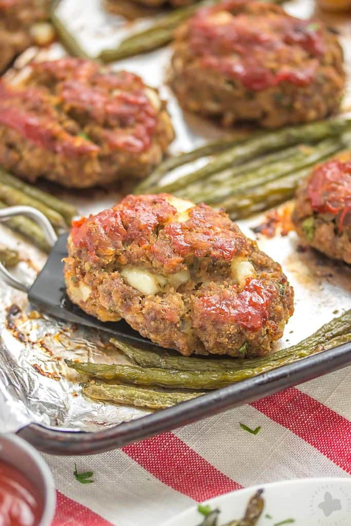 Single shot of Mini Meatloaves on a sheet pan