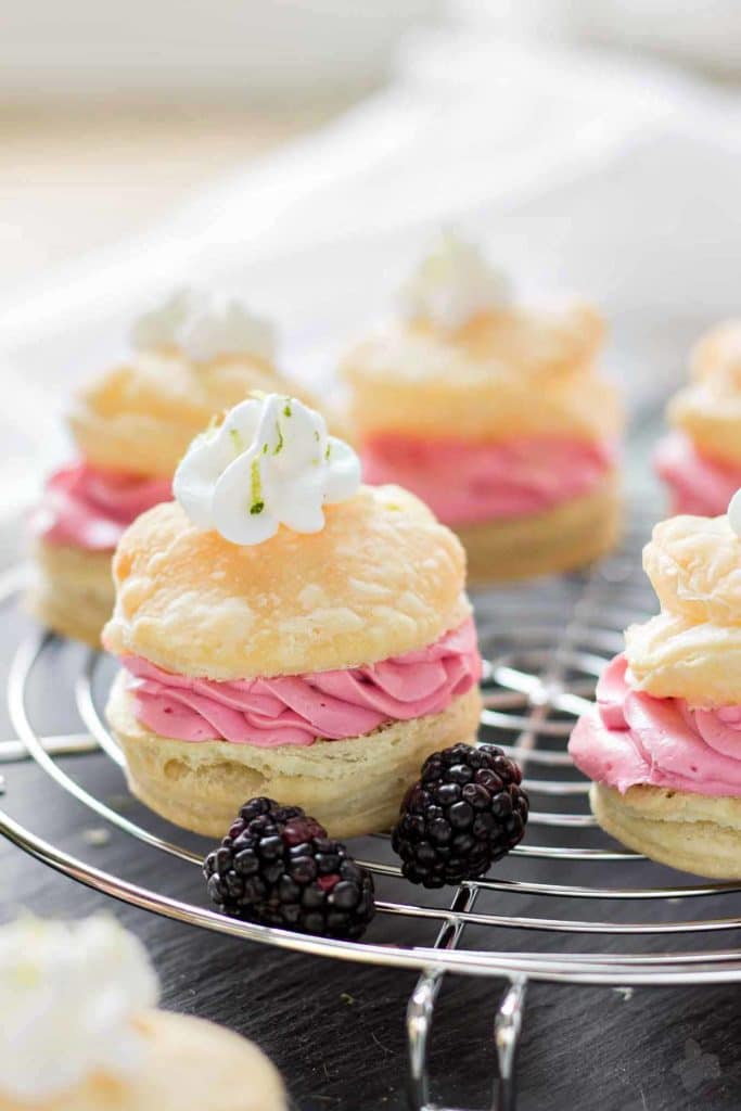 These elegant but simple, Blackberry Lime Buttercream Puffs are sweet, creamy and light. They're filled with a delicious homemade lime curd and fresh blackberry compote. | Strawberry Blondie Kitchen