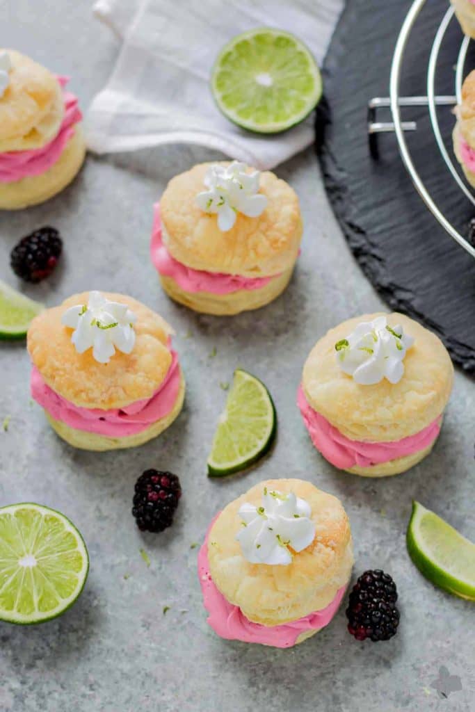 These elegant but simple, Blackberry Lime Buttercream Puffs are sweet, creamy and light. They're filled with a delicious homemade lime curd and fresh blackberry compote. | Strawberry Blondie Kitchen