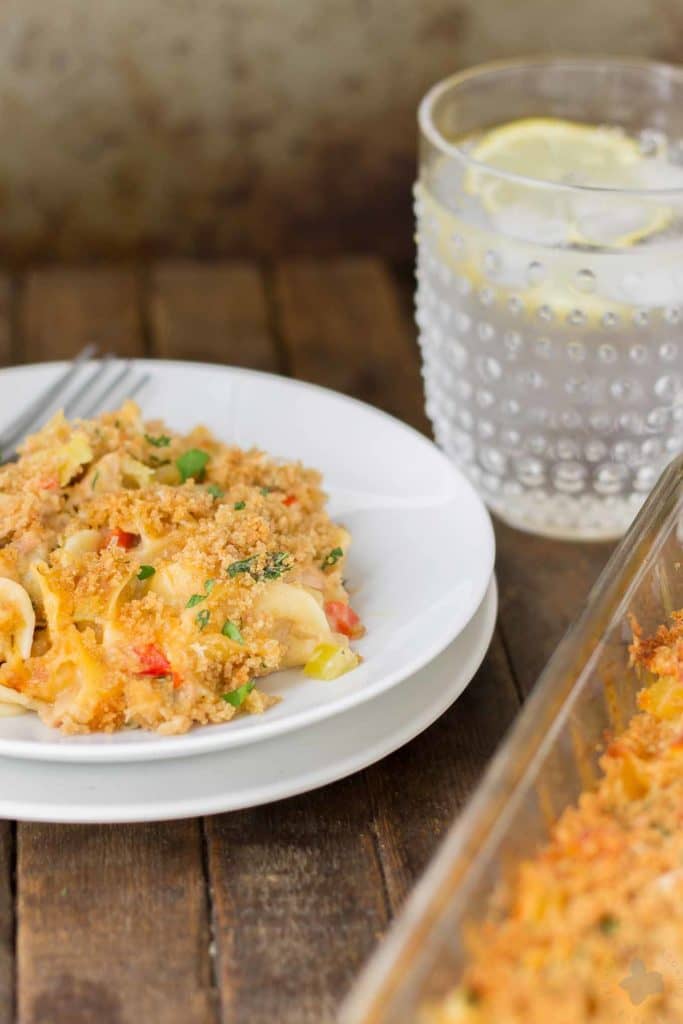 Delicious, creamy and made healthier with a few ingredient swaps, this Lightened Up Cheesy Tuna Noodle Casserole has all the flavors you loved from when you were a kid! | Strawberry Blondie Kitchen