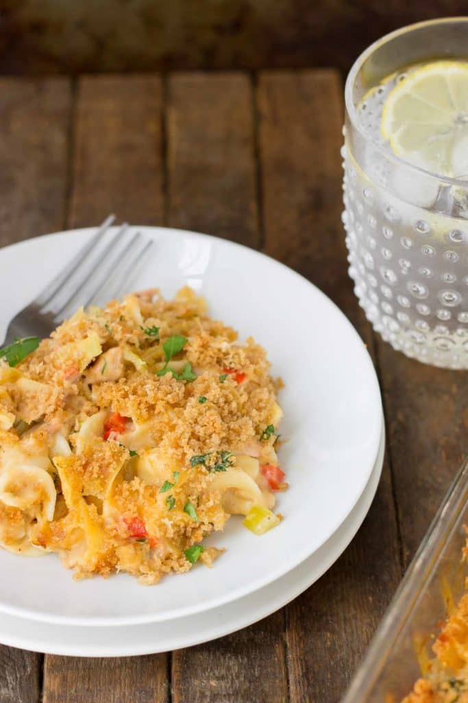 Delicious, creamy and made healthier with a few ingredient swaps, this Lightened Up Cheesy Tuna Noodle Casserole has all the flavors you loved from when you were a kid! | Strawberry Blondie Kitchen