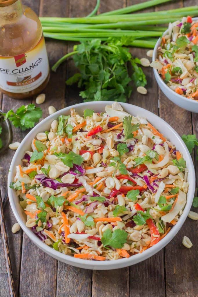 Simple and delicious, this Asian Sesame Noodle Slaw comes together quickly with a little help from P.F. Chang's Sesame sauce for you to be side dish ready in 5 minutes! | Strawberry Blondie Kitchen