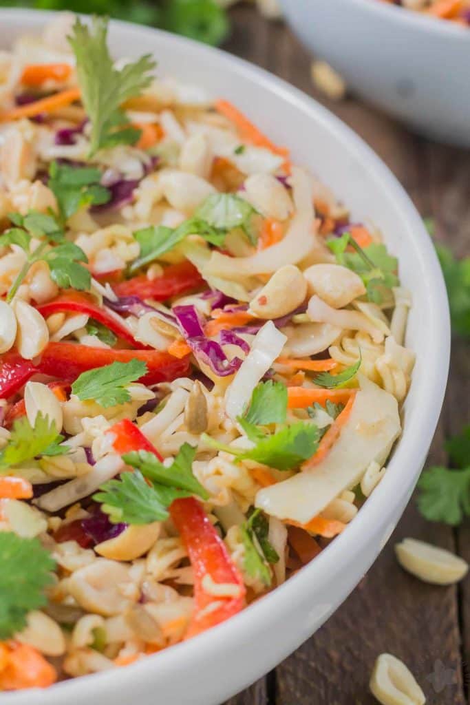Simple and delicious, this Asian Sesame Noodle Slaw comes together quickly with a little help from P.F. Chang's Sesame sauce for you to be side dish ready in 5 minutes! | Strawberry Blondie Kitchen