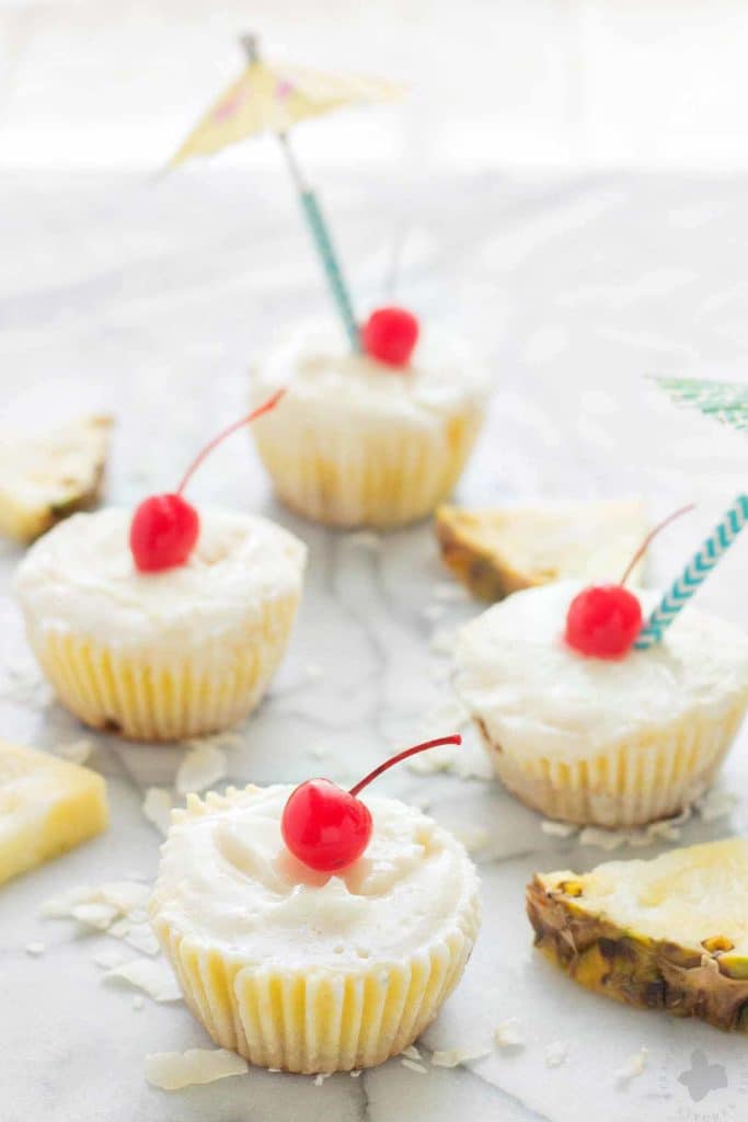 Piña Colada Ice Cream Bites are the perfect treat to cool down this summer. Layers of coconut crust, pureed pineapple and Coconut ProYo High Protein Low Fat Ice Cream make these your new summertime dessert. | Strawberry Blondie Kitchen