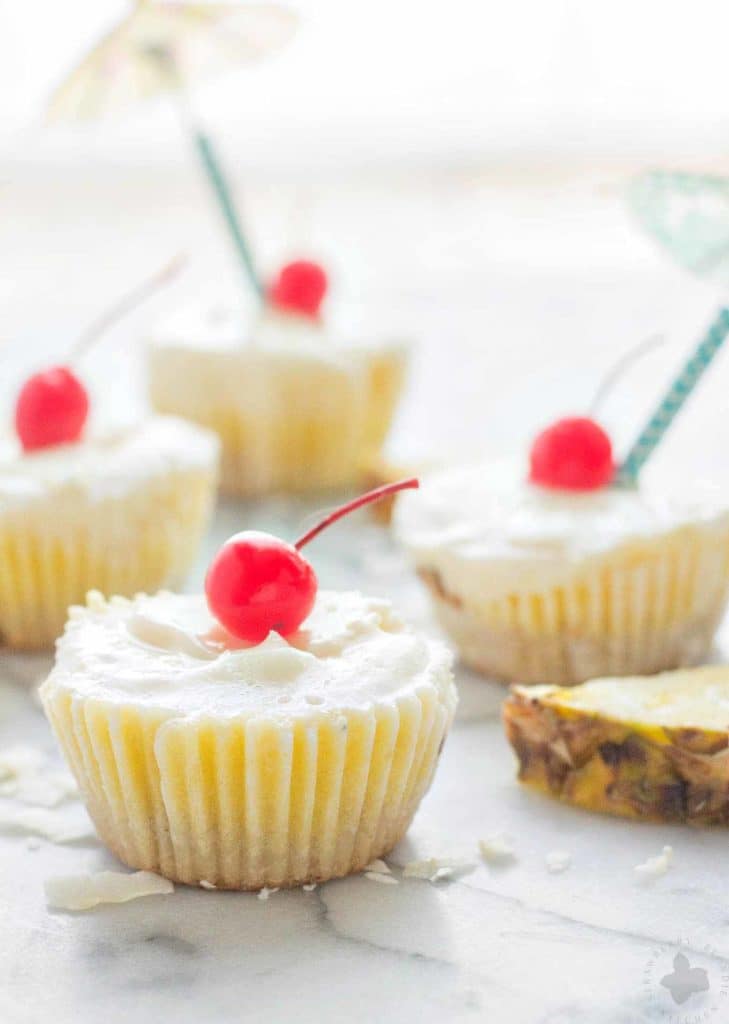 Piña Colada Ice Cream Bites are the perfect treat to cool down this summer. Layers of coconut crust, pureed pineapple and Coconut ProYo High Protein Low Fat Ice Cream make these your new summertime dessert. | Strawberry Blondie Kitchen