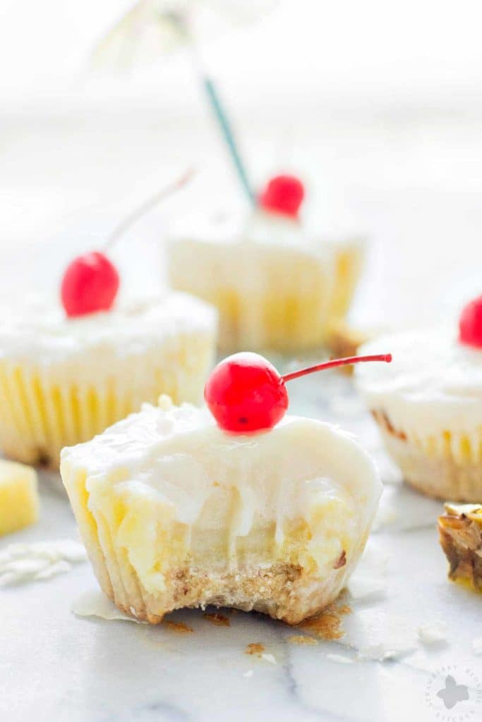 Piña Colada Ice Cream Bites are the perfect treat to cool down this summer. Layers of coconut crust, pureed pineapple and Coconut ProYo High Protein Low Fat Ice Cream make these your new summertime dessert. | Strawberry Blondie Kitchen