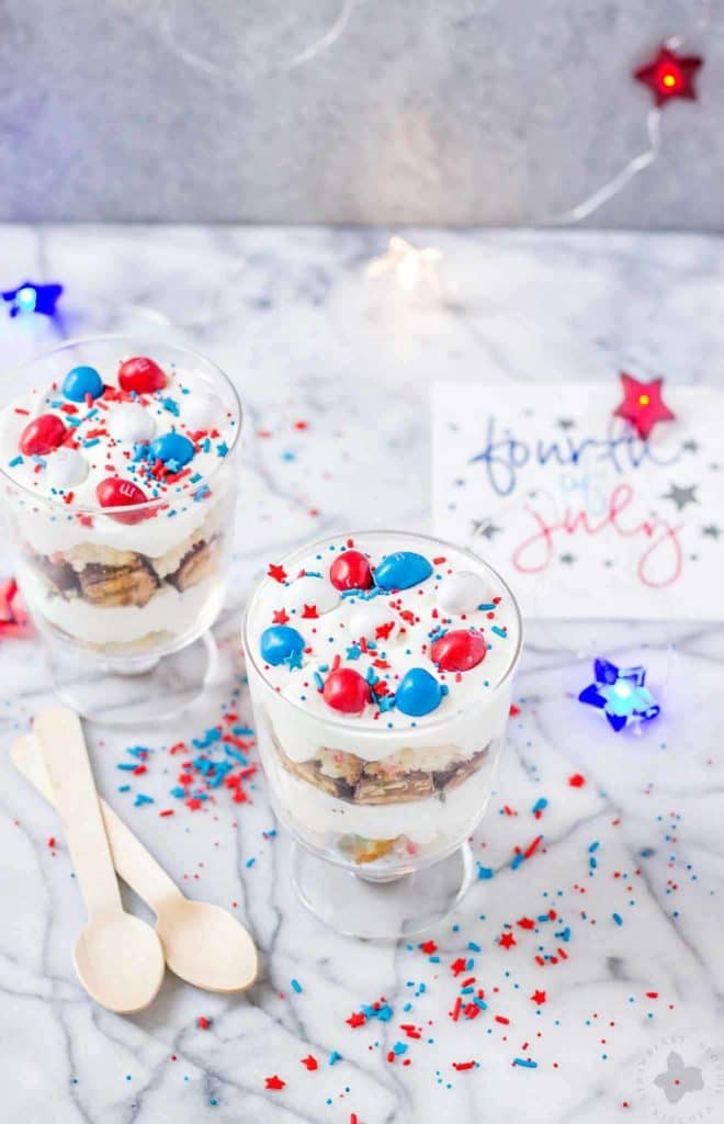 Layers of Pillsbury™ Funfetti® Cake, Frosting, Snickers and M&M’s make these Patriotic Mini Trifles the best way to spread your love of Red, White and Blue! | Strawberry Blondie Kitchen